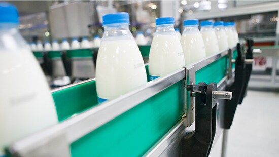 Milk bottles on a line