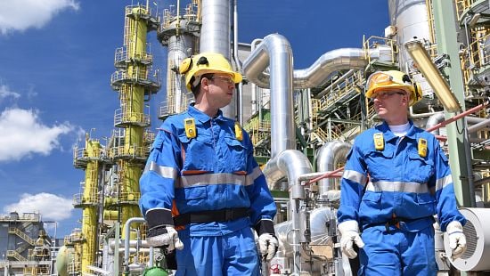 operators walking in a chemical processing plant